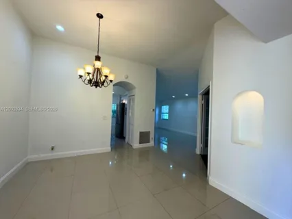 a view of a room with a chandelier and chandelier