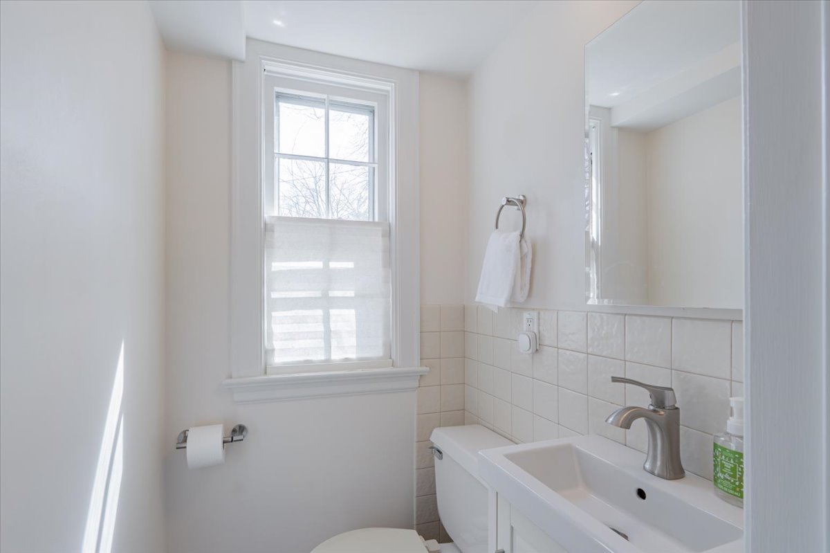 413 Grant Street Normal, IL 61761 - Photo 15 of 40 a bathroom with a sink a toilet and tub