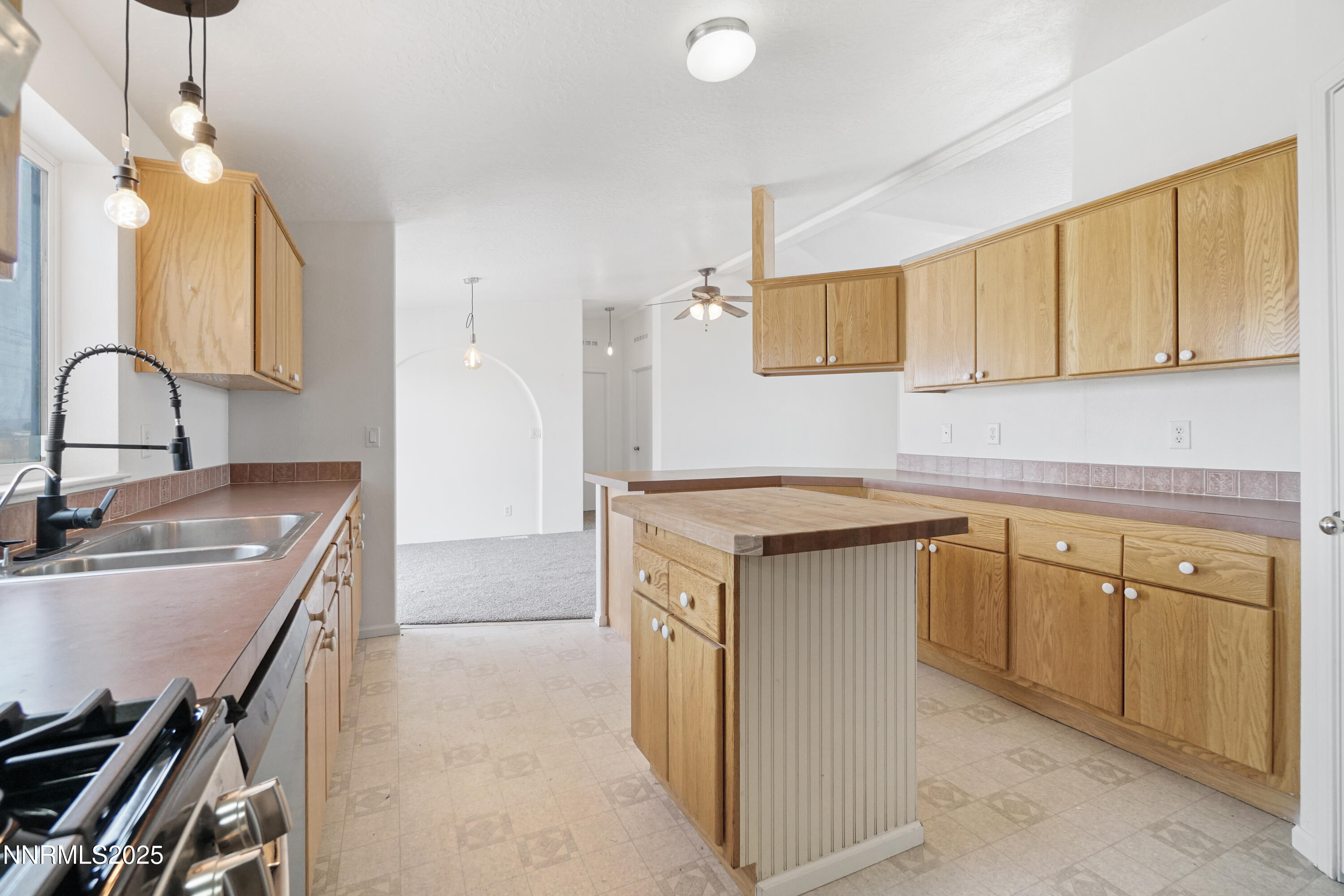 11575 Fulkerson Road Fallon, NV 89406 - Photo 12 of 25 a kitchen with a sink stove and cabinets