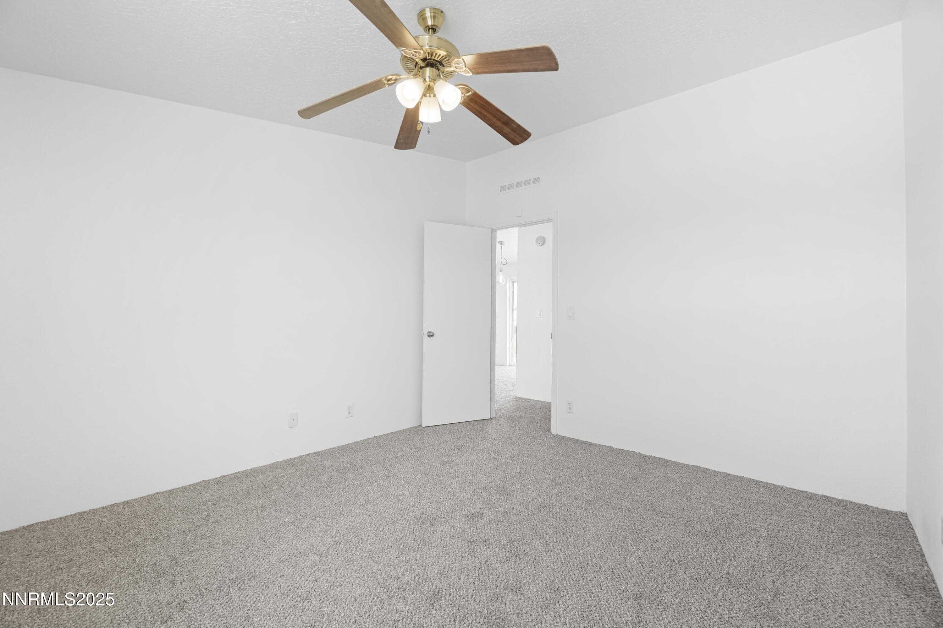 11575 Fulkerson Road Fallon, NV 89406 - Photo 16 of 25 an empty room with a fan and a fan