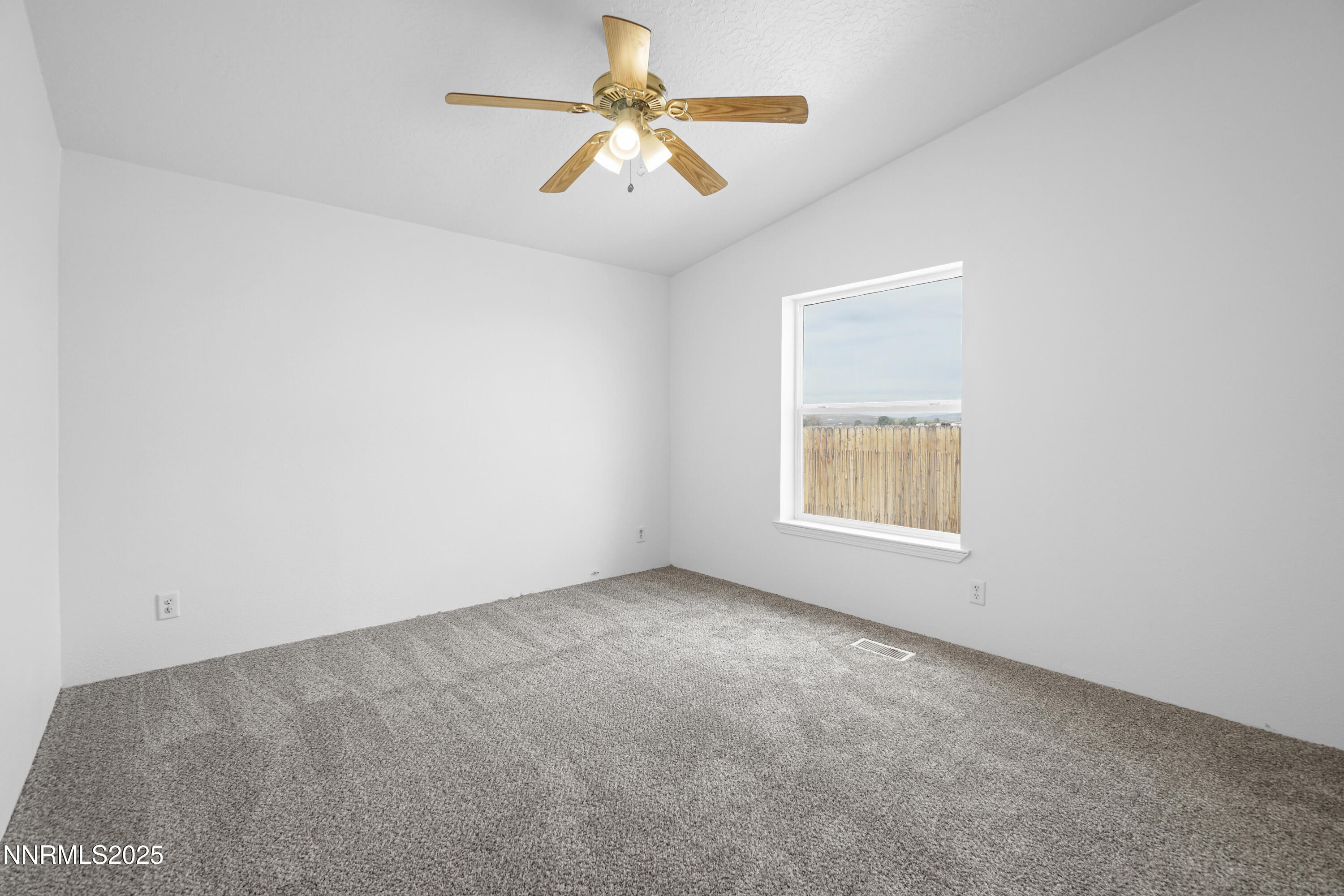 11575 Fulkerson Road Fallon, NV 89406 - Photo 17 of 25 an empty room with a window and a fan