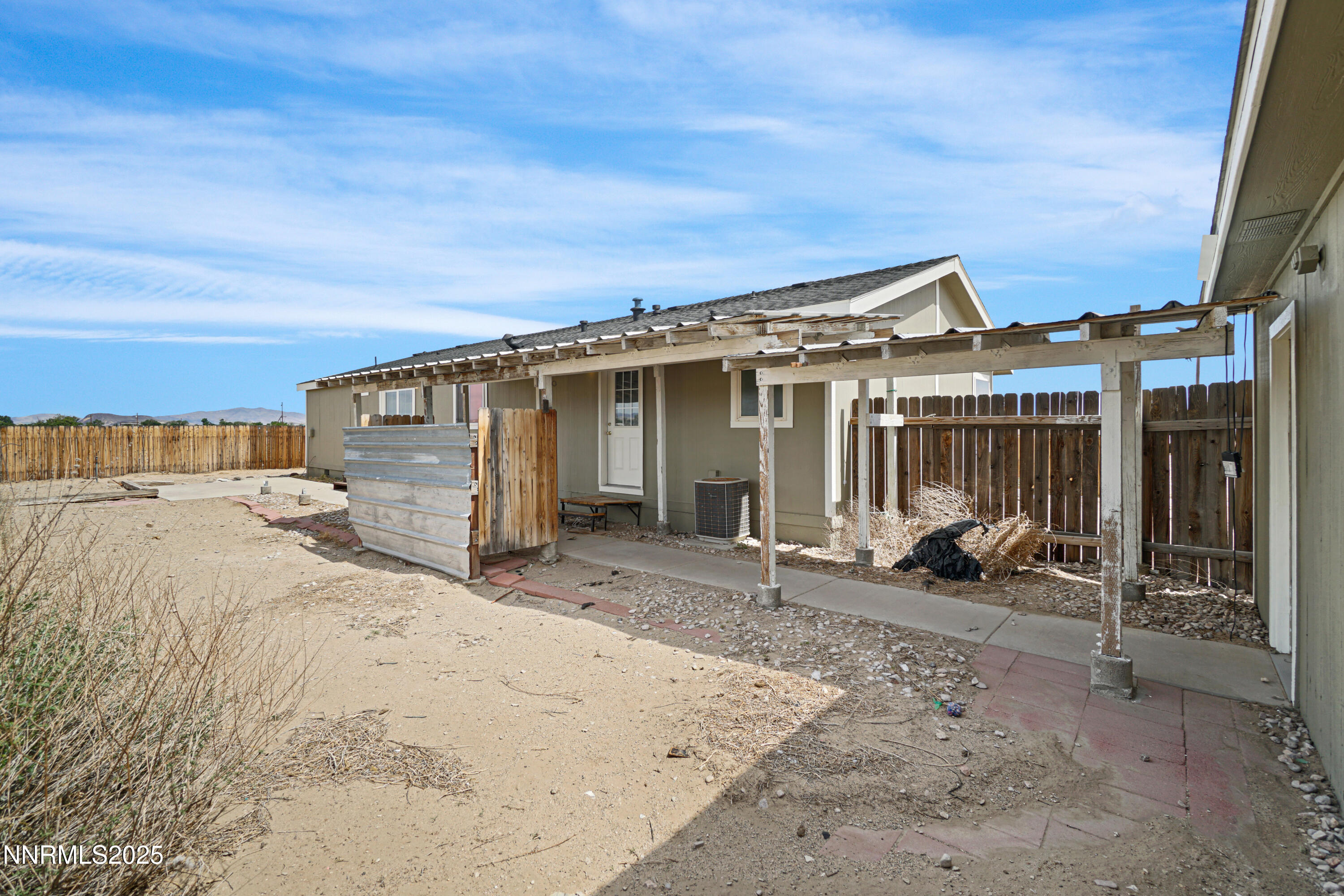 11575 Fulkerson Road Fallon, NV 89406 - Photo 21 of 25 a view of a house with wooden walls