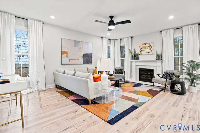 a living room with furniture fireplace and window