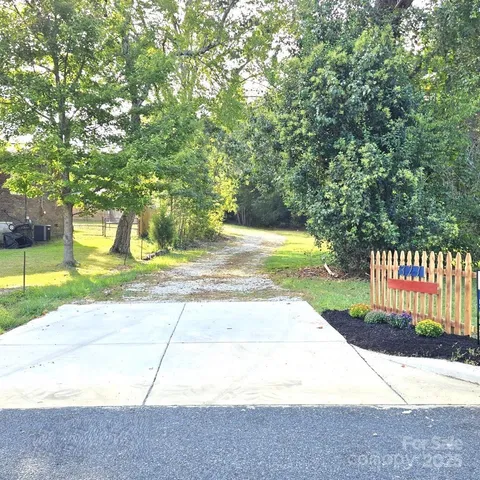 a view of a garden with a pathway