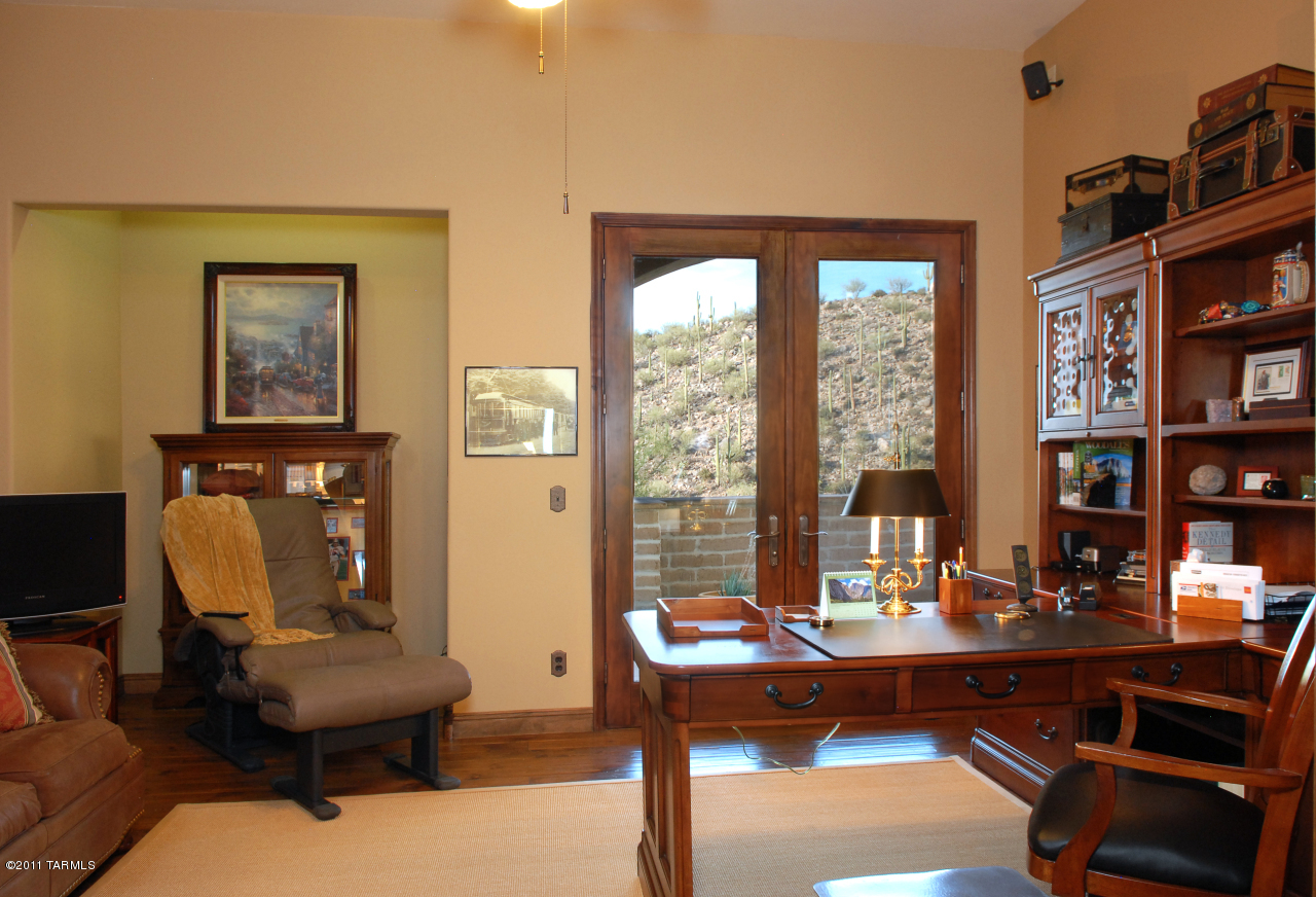 2188 East Buck Ridge Place Oro Valley, AZ 85737 - Photo 12 of 22 a living room with furniture and large window