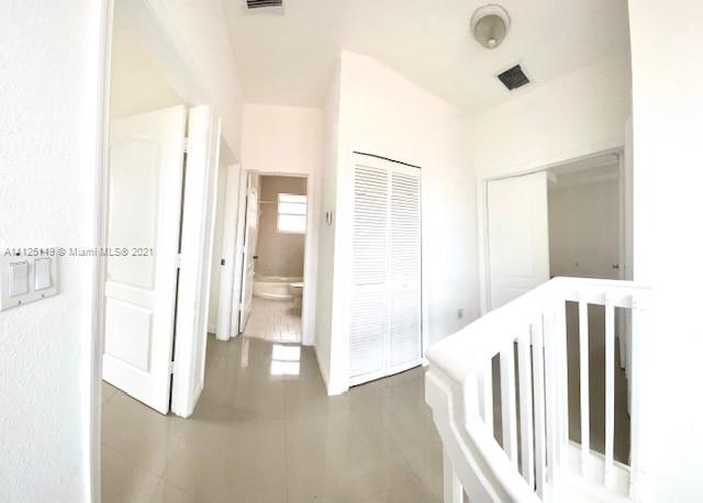 15368 Southwest 25th Terrace Miami, FL 33185 - Photo 11 of 30 a view of a hallway with a white walls