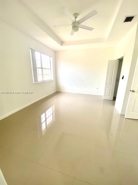 15368 Southwest 25th Terrace Miami, FL 33185 - Photo 15 of 30 a view of empty room with wooden floor and fan