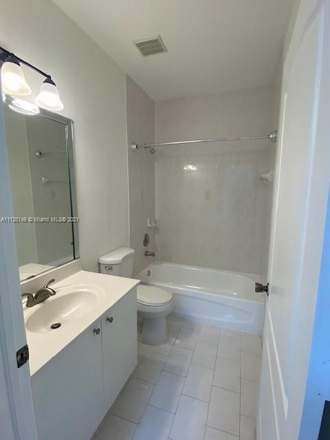 15368 Southwest 25th Terrace Miami, FL 33185 - Photo 25 of 30 a bathroom with a double vanity sink toilet and shower