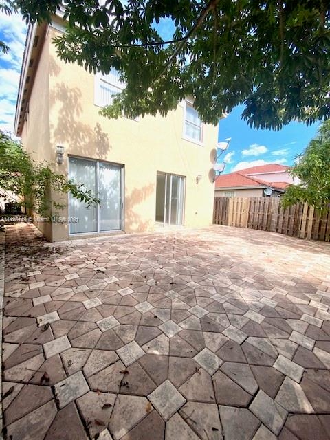 15368 Southwest 25th Terrace Miami, FL 33185 - Photo 29 of 30 a backyard of a house with lots of green space and tree