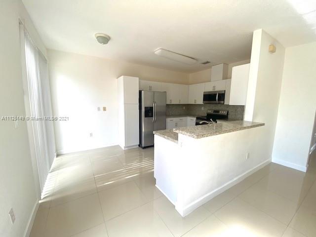 15368 Southwest 25th Terrace Miami, FL 33185 - Photo 4 of 30 a view of a kitchen with appliances