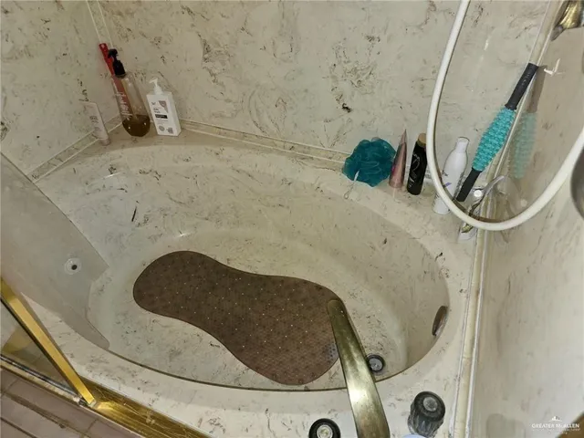a bathroom with a shower and a toilet