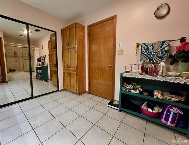 a spacious bathroom with a sink mirror and shower