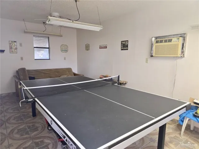a view of a backyard with sitting area and garden