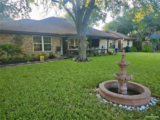 a view of a back yard with a garden and plants