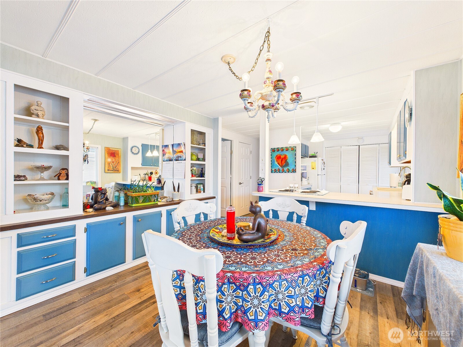4805 Cushman Road Northeast, Unit 56 Olympia, WA 98506 - Photo 12 of 30 a view of a dining room with furniture and wooden floor