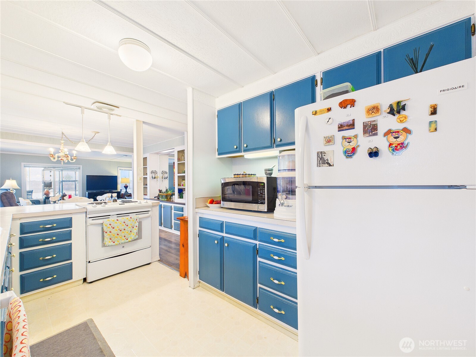 4805 Cushman Road Northeast, Unit 56 Olympia, WA 98506 - Photo 17 of 30 a kitchen with stainless steel appliances a refrigerator and a stove