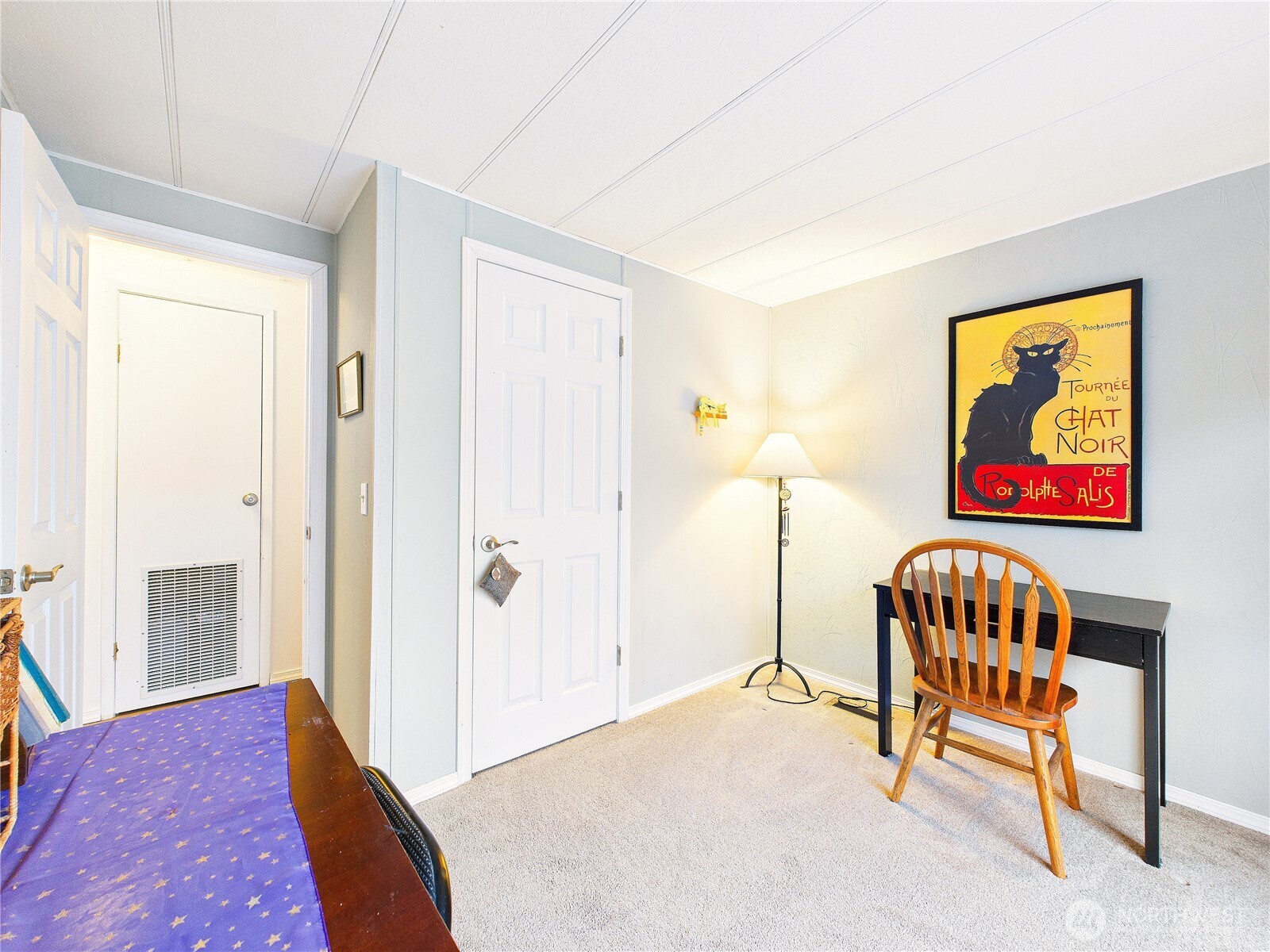 4805 Cushman Road Northeast, Unit 56 Olympia, WA 98506 - Photo 21 of 30 a bedroom with a bed and a painting on the wall