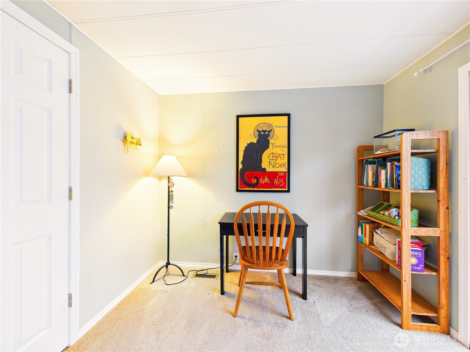 4805 Cushman Road Northeast, Unit 56 Olympia, WA 98506 - Photo 22 of 30 a bedroom with furniture and a book shelf