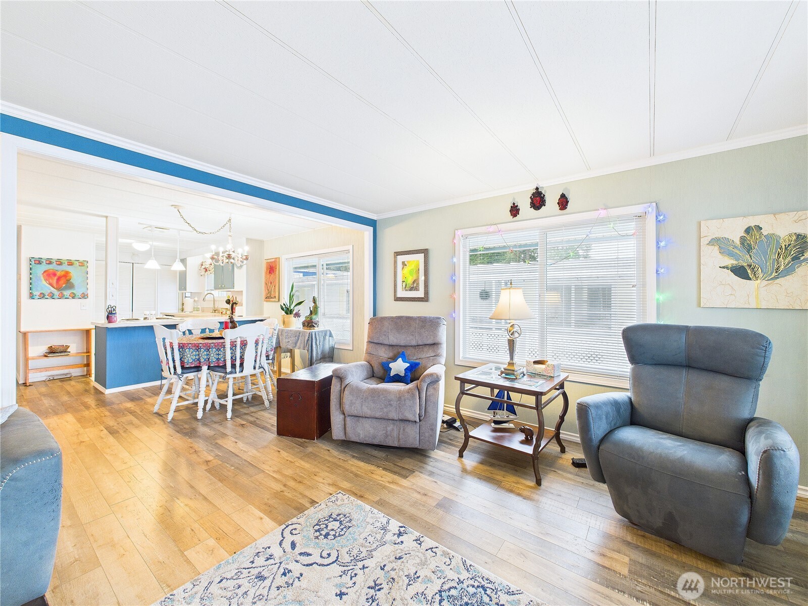 4805 Cushman Road Northeast, Unit 56 Olympia, WA 98506 - Photo 5 of 30 a living room with furniture wooden floor and a large window
