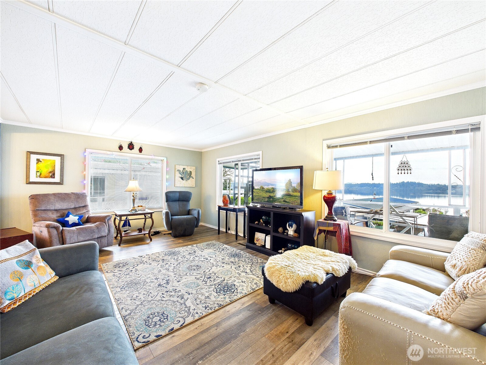 4805 Cushman Road Northeast, Unit 56 Olympia, WA 98506 - Photo 6 of 30 a living room with furniture and a flat screen tv