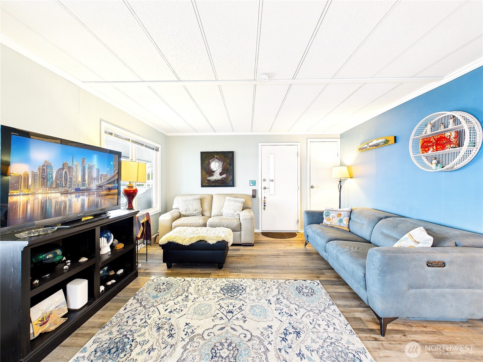 4805 Cushman Road Northeast, Unit 56 Olympia, WA 98506 - Photo 7 of 30 a living room with furniture and a flat screen tv