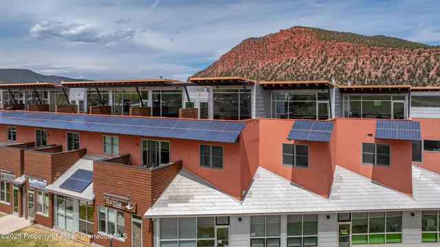 front view of a building with a yard