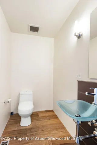 a bathroom with a toilet and a sink