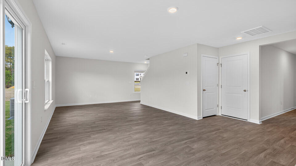 3604 Turney Drive Raleigh, NC 27610 - Photo 14 of 39 a view of an empty room with wooden floor