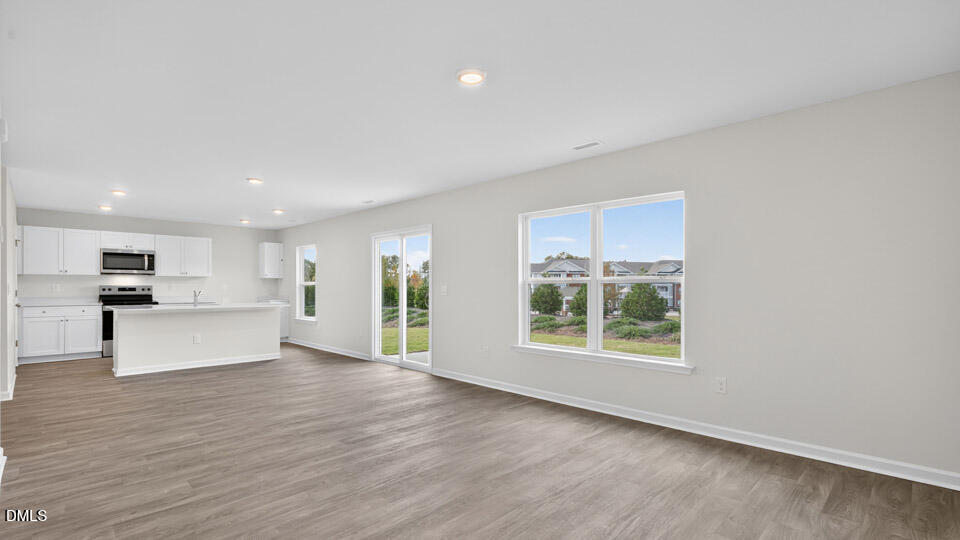 3604 Turney Drive Raleigh, NC 27610 - Photo 16 of 39 a view of kitchen with furniture and wooden floor