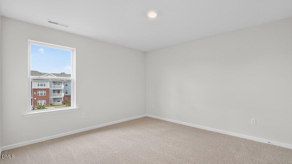 3604 Turney Drive Raleigh, NC 27610 - Photo 18 of 39 an empty room with windows