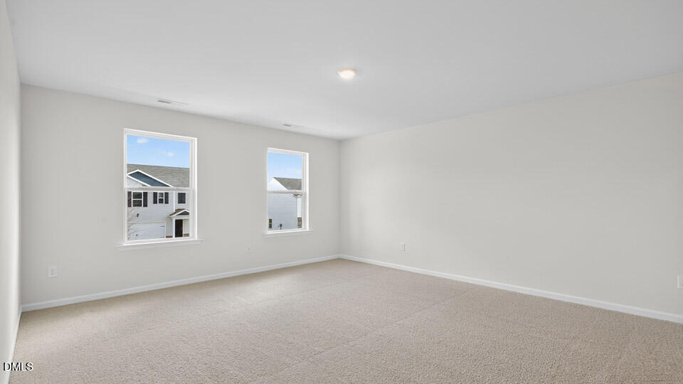 3604 Turney Drive Raleigh, NC 27610 - Photo 22 of 39 an empty room with windows
