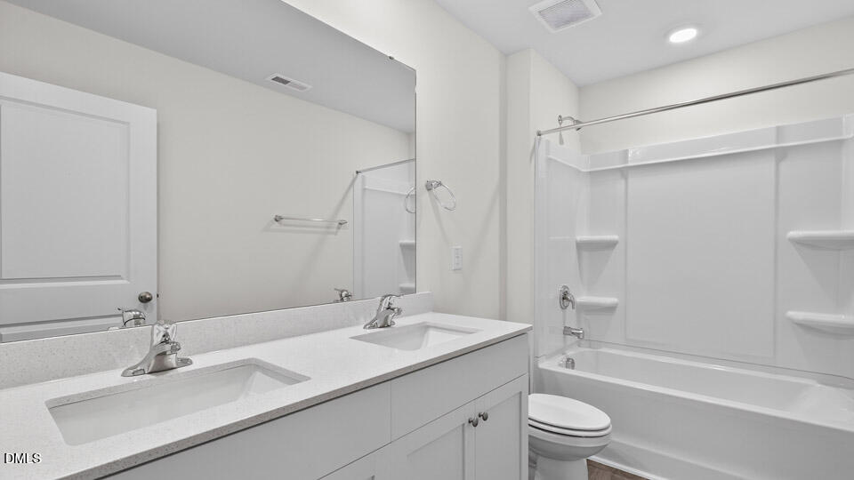 3604 Turney Drive Raleigh, NC 27610 - Photo 29 of 39 a bathroom with a sink toilet a tub and shower