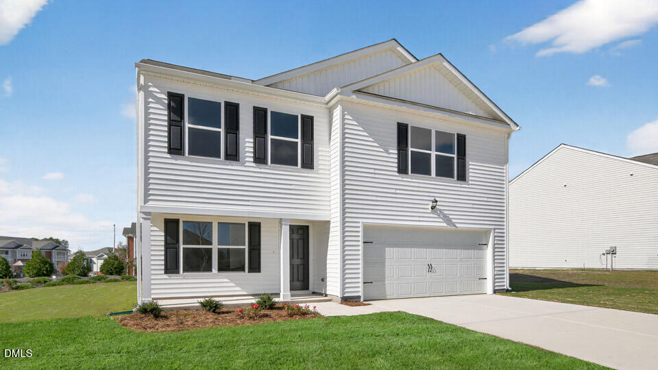 3604 Turney Drive Raleigh, NC 27610 - Photo 3 of 39 a front view of a house with a yard