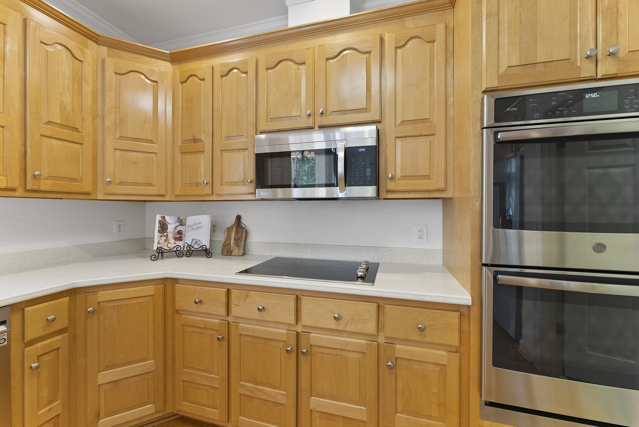 9436 Macon Road Raleigh, NC 27613 - Photo 15 of 37 2023: new cooktop, new microwave, new dishwasher Kitchen