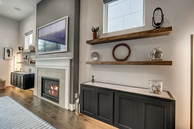 a hallway with a fireplace and a mirror