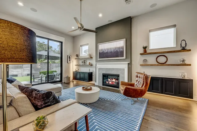 a living room with furniture and a fireplace