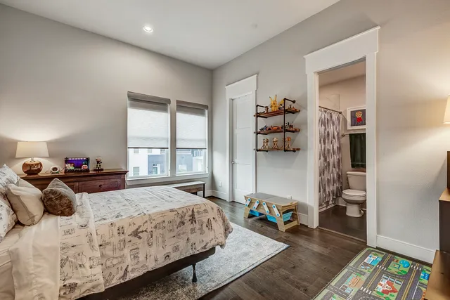 a bedroom with a bed furniture and a window