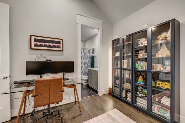 a view of a workspace with furniture and cabinet