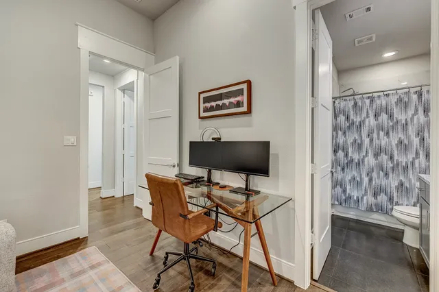 a workspace with furniture and a gate