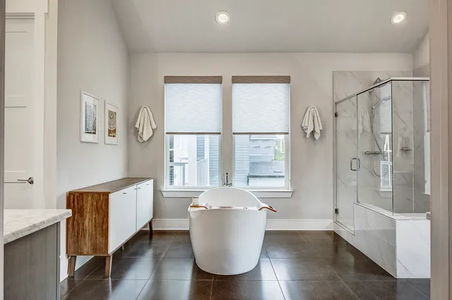 a living room with a window and wooden floor