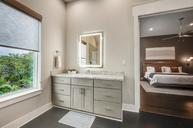 a living room with furniture window and wooden floor
