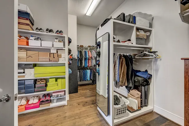 an outdoor sitting area with furniture and umbrella