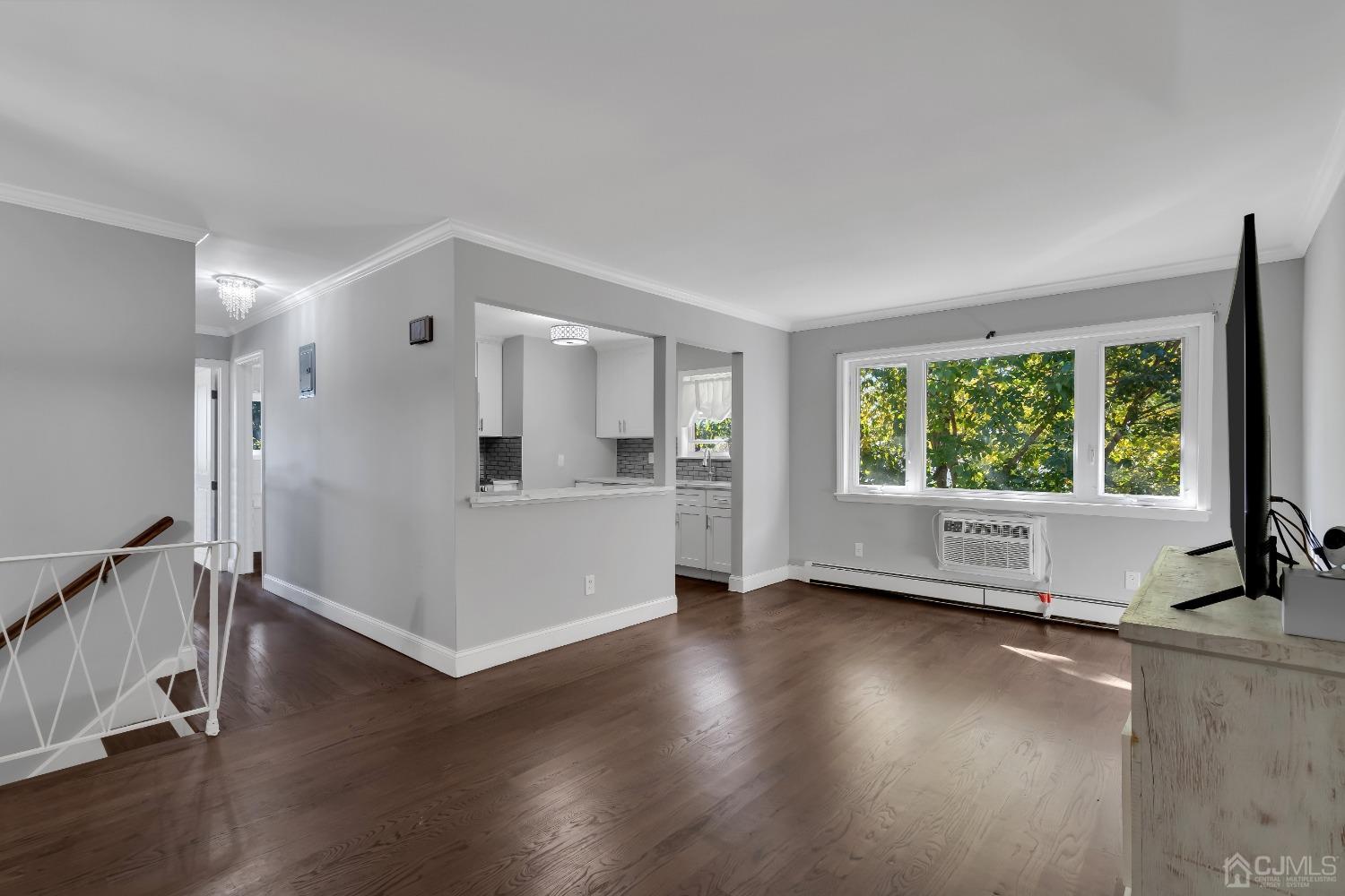 435 Teaneck Road, Unit 21 Ridgefield Park, NJ 07660 - Photo 1 of 20 a view of empty room with wooden floor and fan