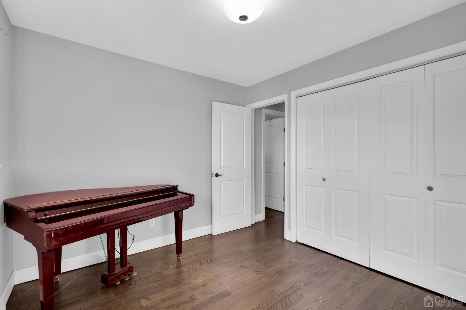 435 Teaneck Road, Unit 21 Ridgefield Park, NJ 07660 - Photo 16 of 20 a room with a bench and wooden floor