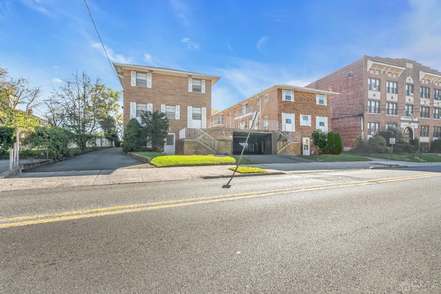 435 Teaneck Road, Unit 21 Ridgefield Park, NJ 07660 - Photo 19 of 20 a view of a building with a swimming pool