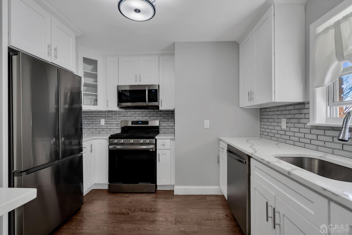 435 Teaneck Road, Unit 21 Ridgefield Park, NJ 07660 - Photo 9 of 20 a kitchen with a refrigerator stove and sink