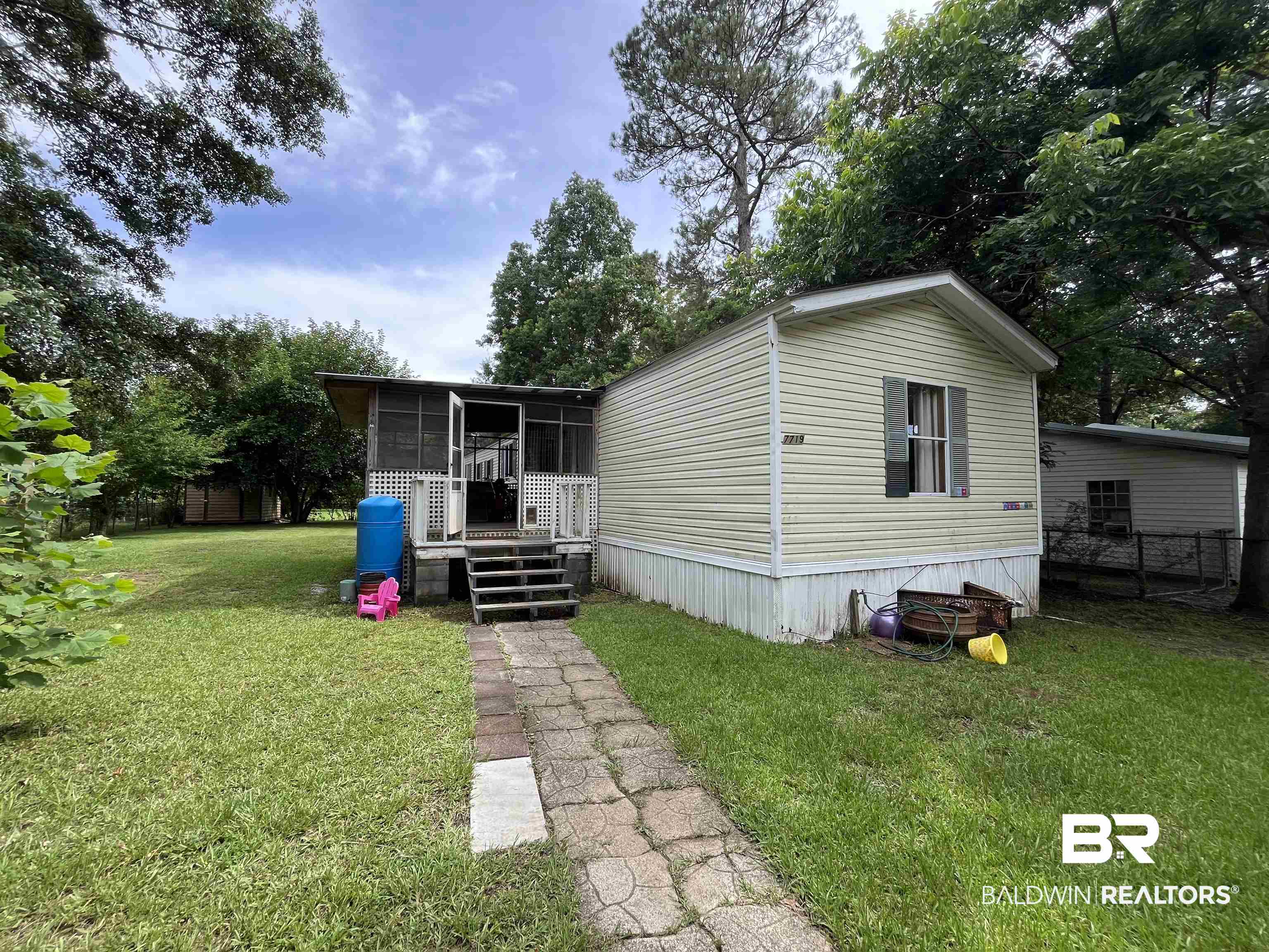 7719 Bermuda Drive Semmes, AL 36575 - Photo 2 of 10 View of front of home with a sunroom
