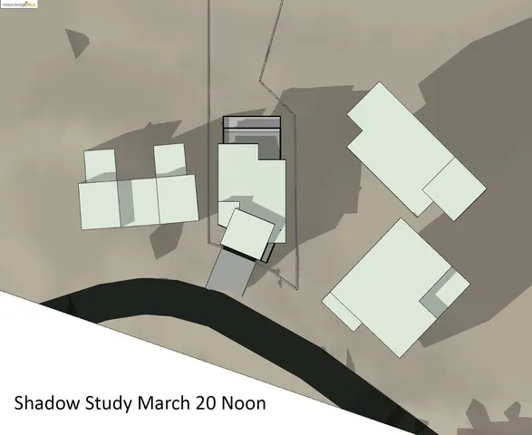 a kitchen with a wooden floor and white walls