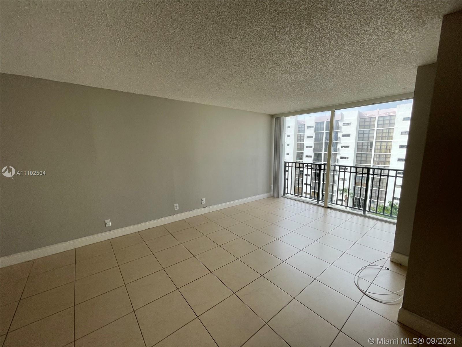 16909 North Bay Road, Unit 807 Sunny Isles Beach, FL 33160 - Photo 3 of 17 an empty room with windows