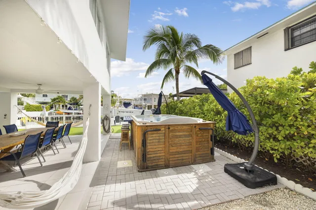 a view of outdoor kitchen with seating area